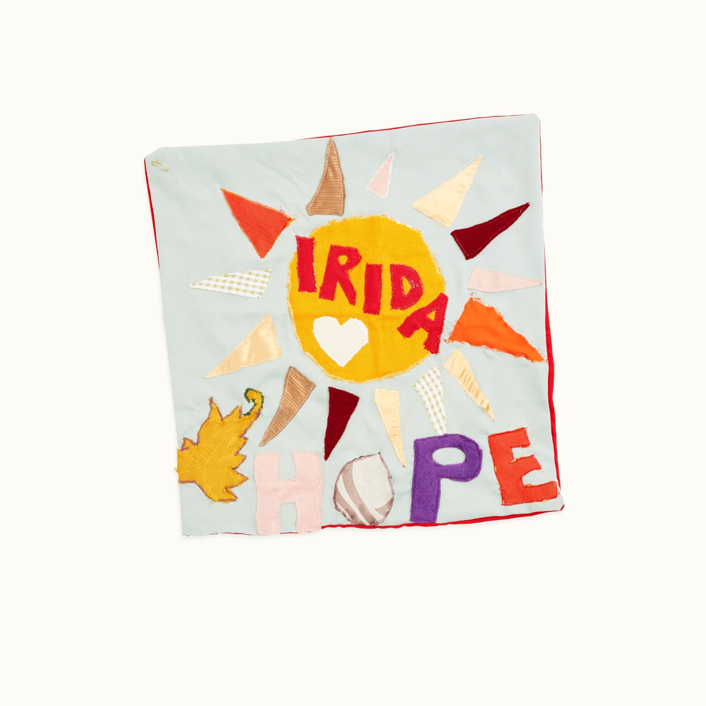 Irida Hope cushion cover with a sun on it.