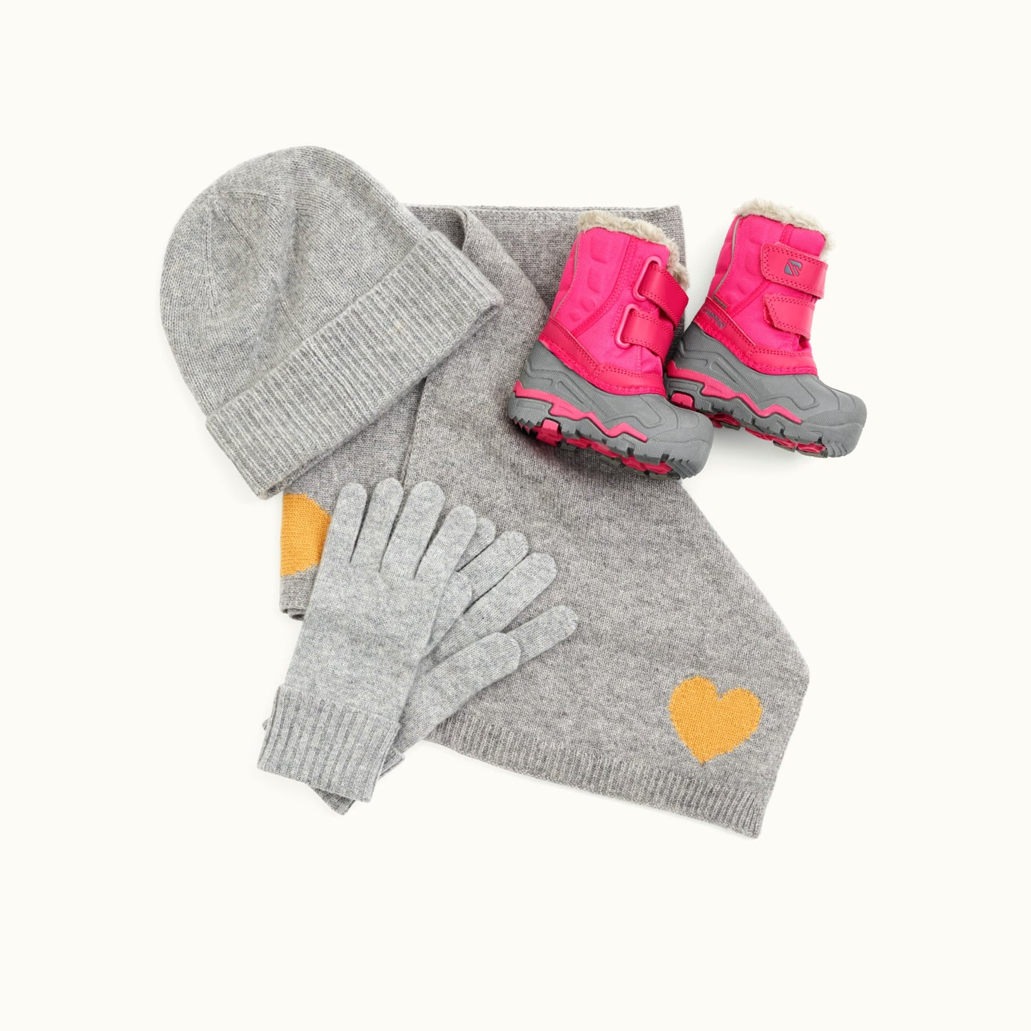 Winter set for children consisting of hat, scarf, gloves and boots.