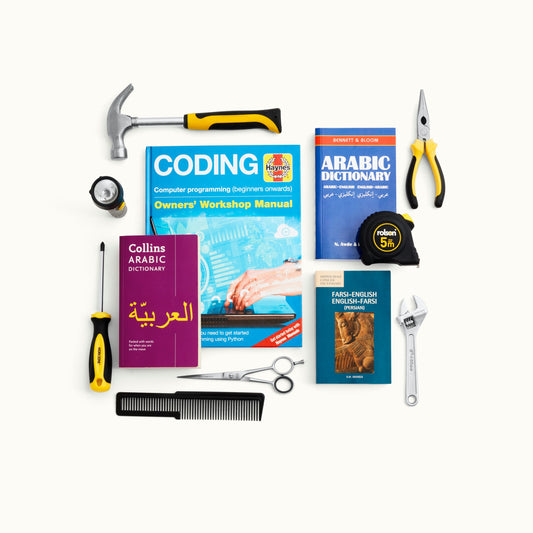 In the image there are displayed a series of exemplary books for learning coding, Arabic dictionary and a Farsi-English, some building tools such as a claw hammer, flashlight, screwdriver, pliers, tapemeasure, as well as hairdressing scissors and comb. These are illustrative examples of the sort of support refugees receive by buying this support for them.