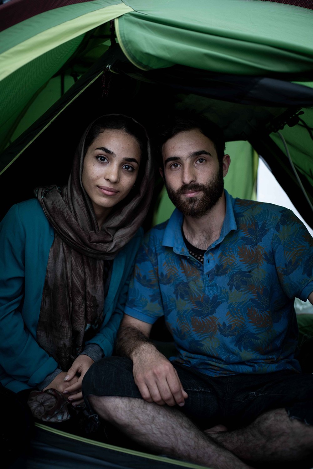 Young refugee couple in a tent.