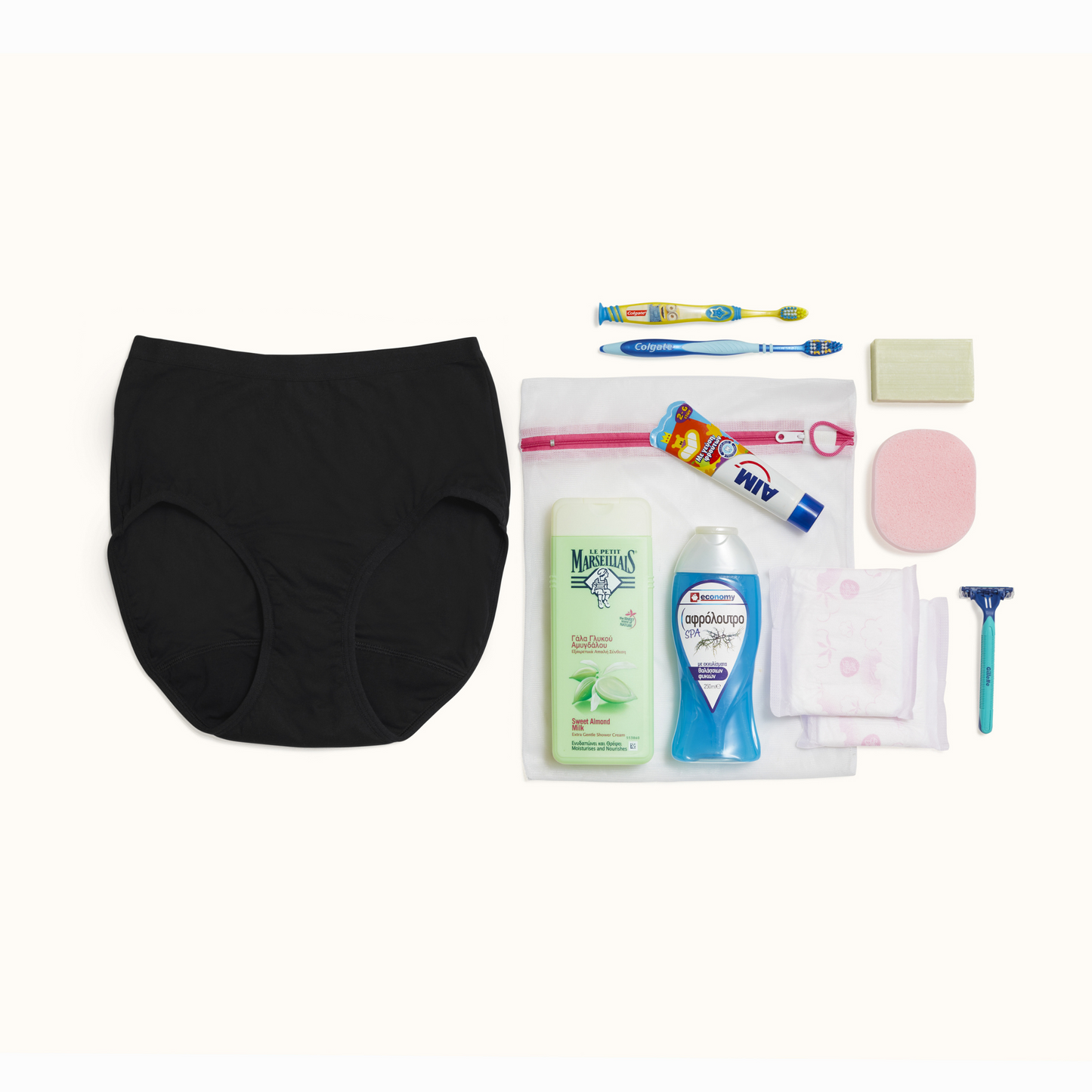 A pair of menstrual pants, 2 toothbrushes, toothpaste, shower gel, shampoo, menstrual pads, a razor, soap bar.